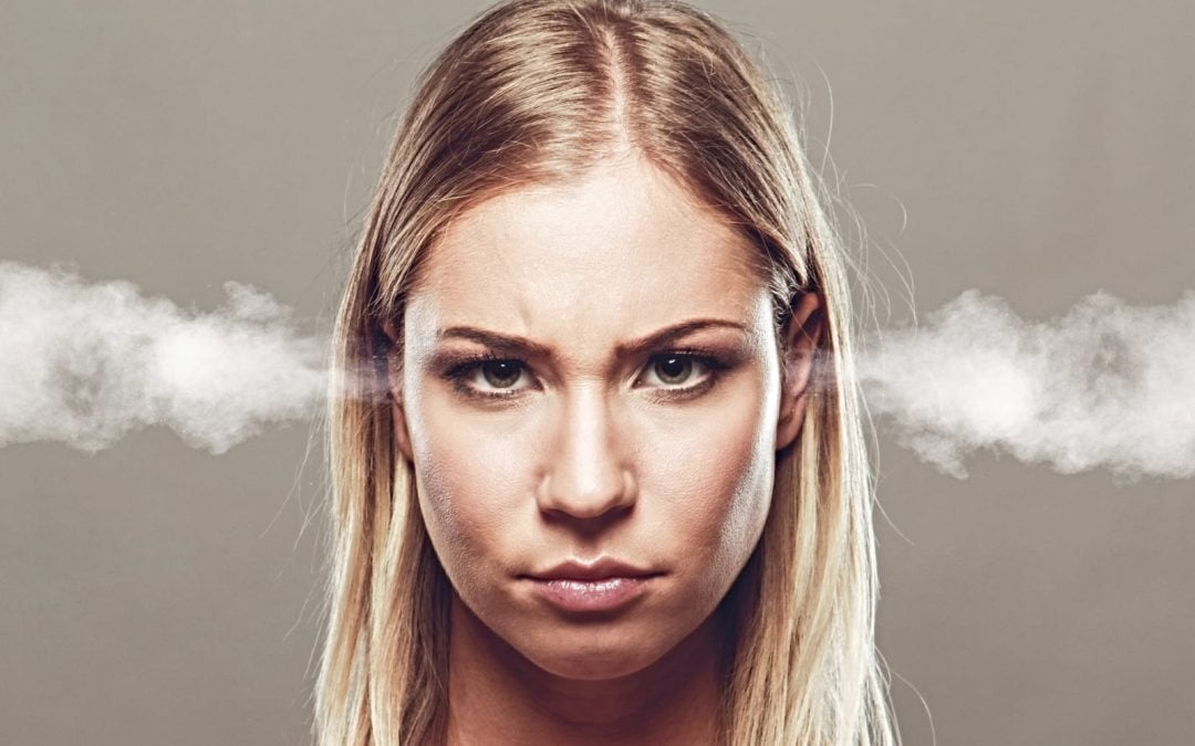 An angry woman with steam coming out of her ears