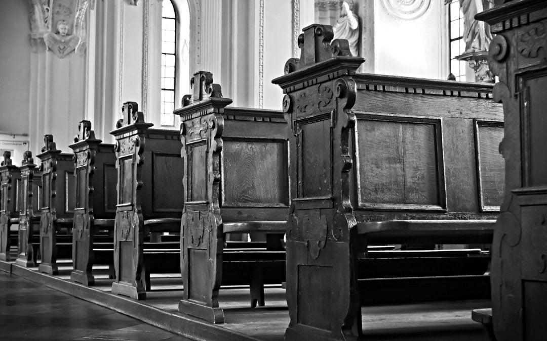 Wooden pews in a church sanctuary