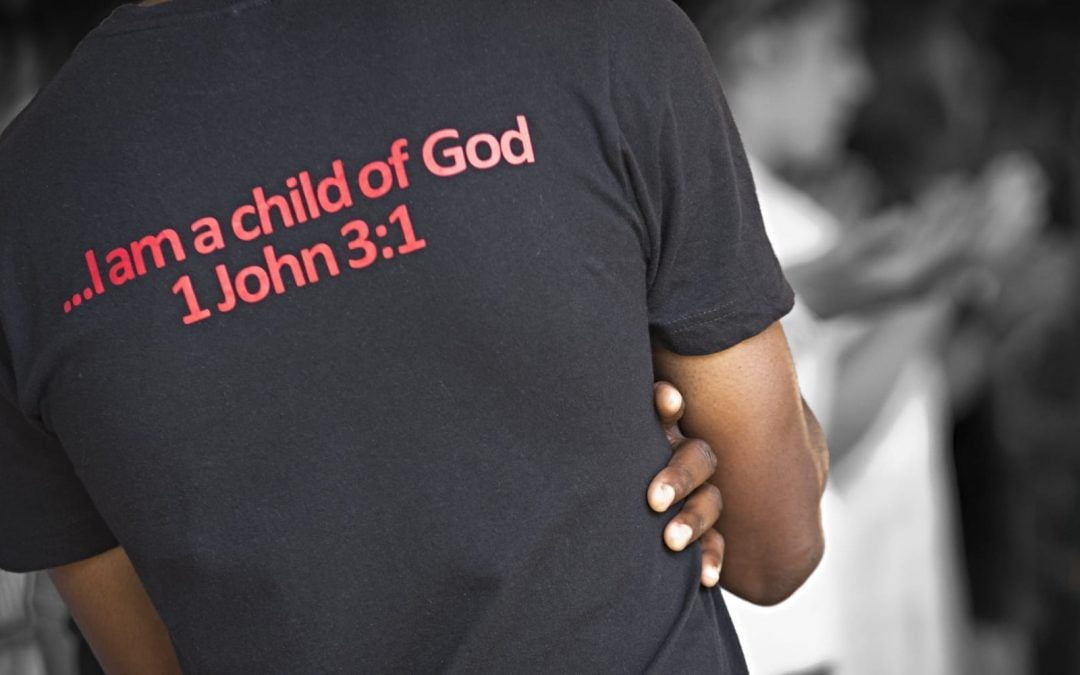 A man wearing a shirt that says I am a child of God