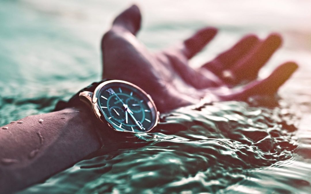 A wrist watch almost under the water
