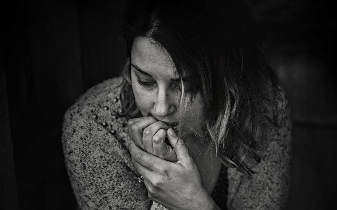 Black-and-white photo of sad girl