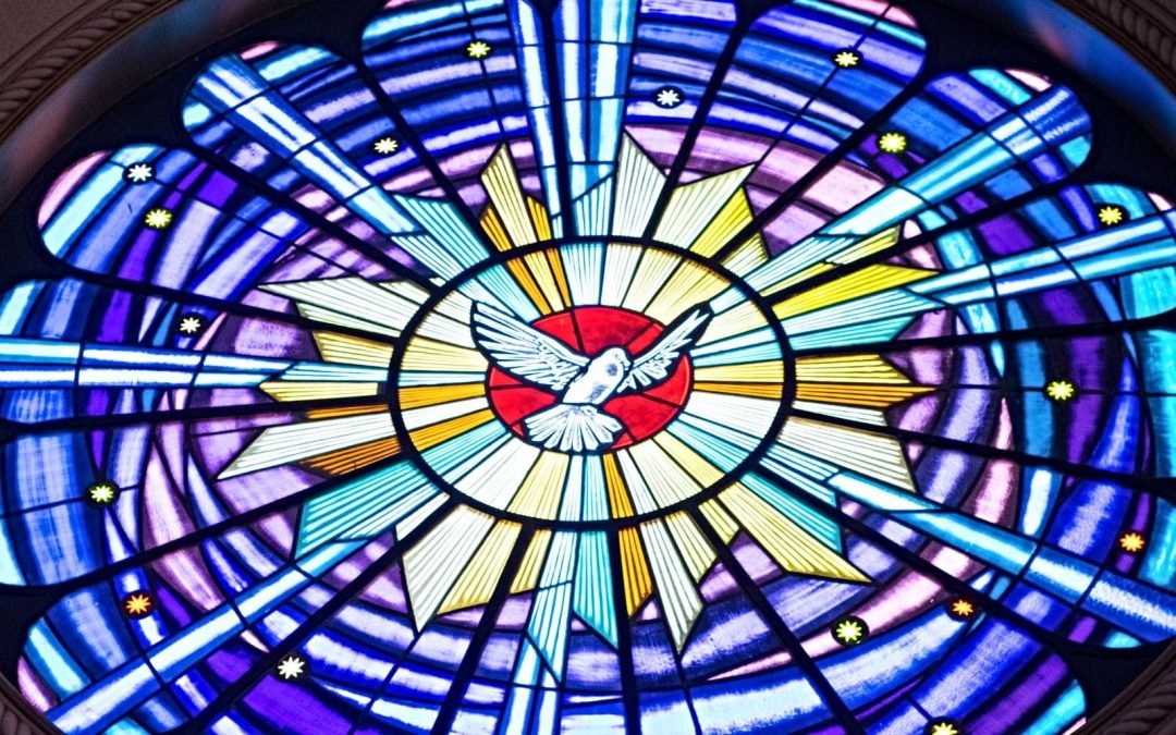 Stained-glass window with dove in center