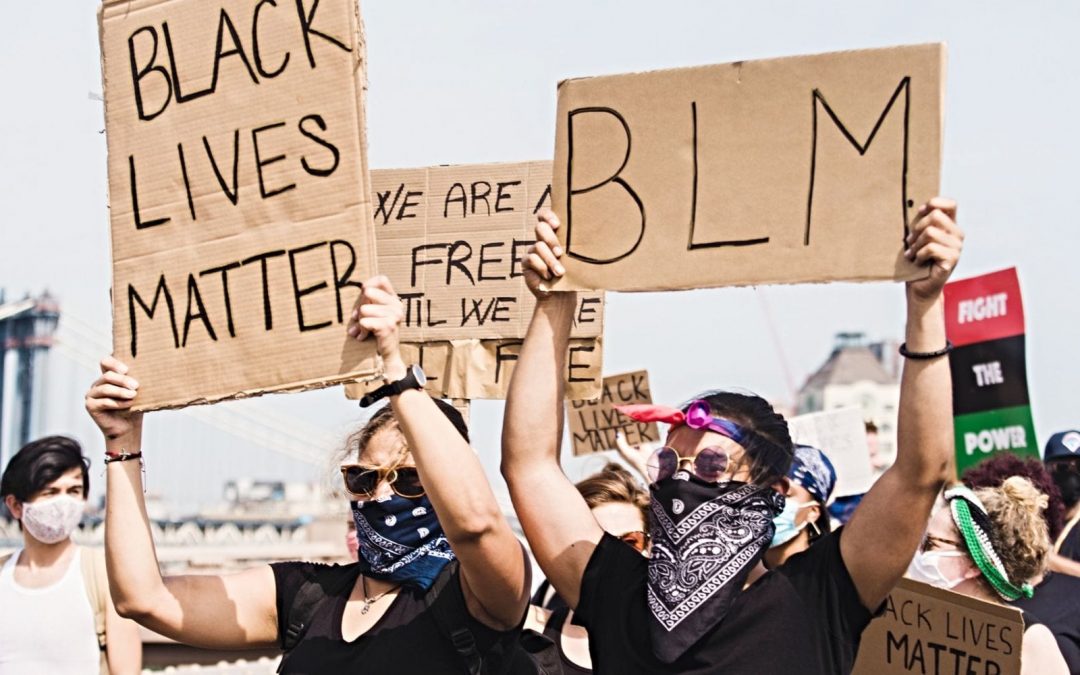 People holding Black Lives Matter signs