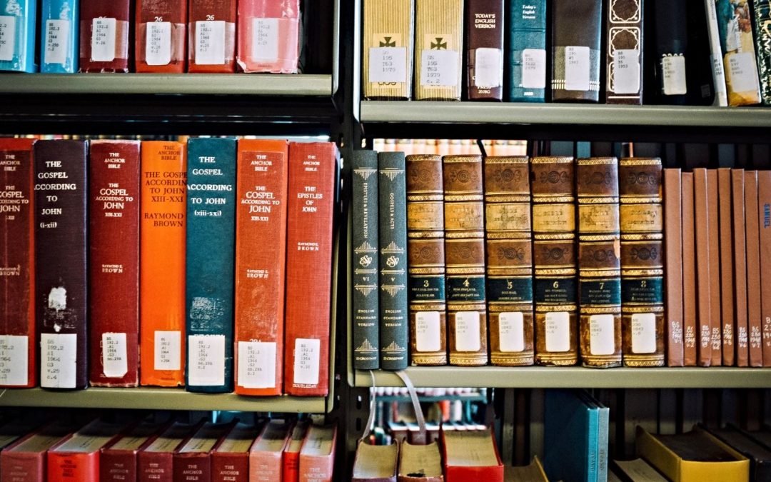 Theology books on library shelves