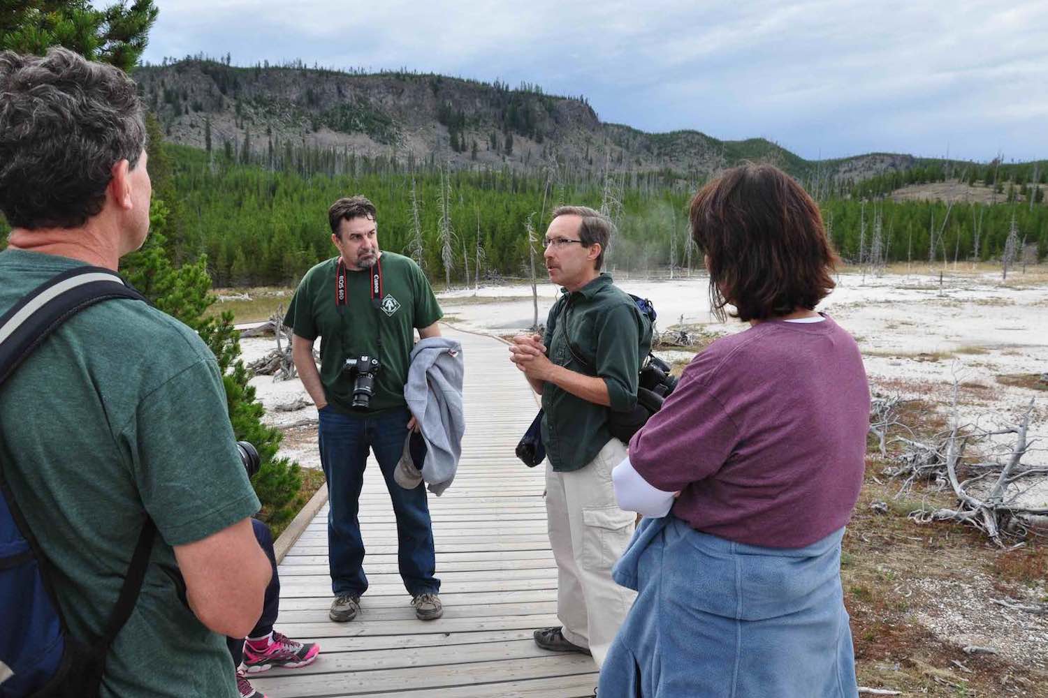 A man leading a tour group in Yellowstone