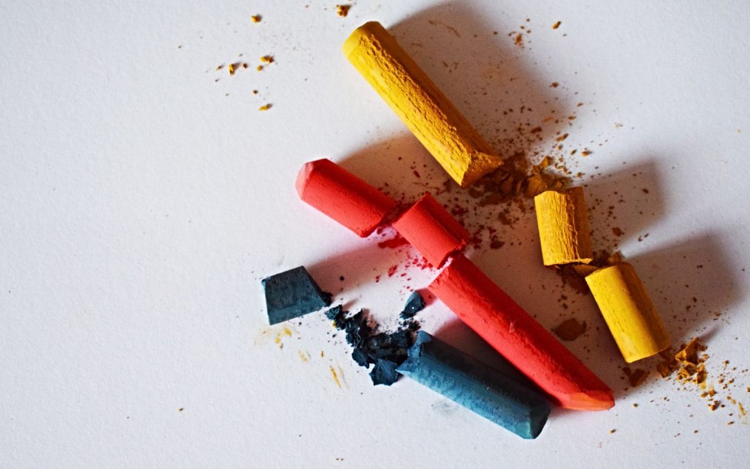 Blue, red and yellow broken chalk