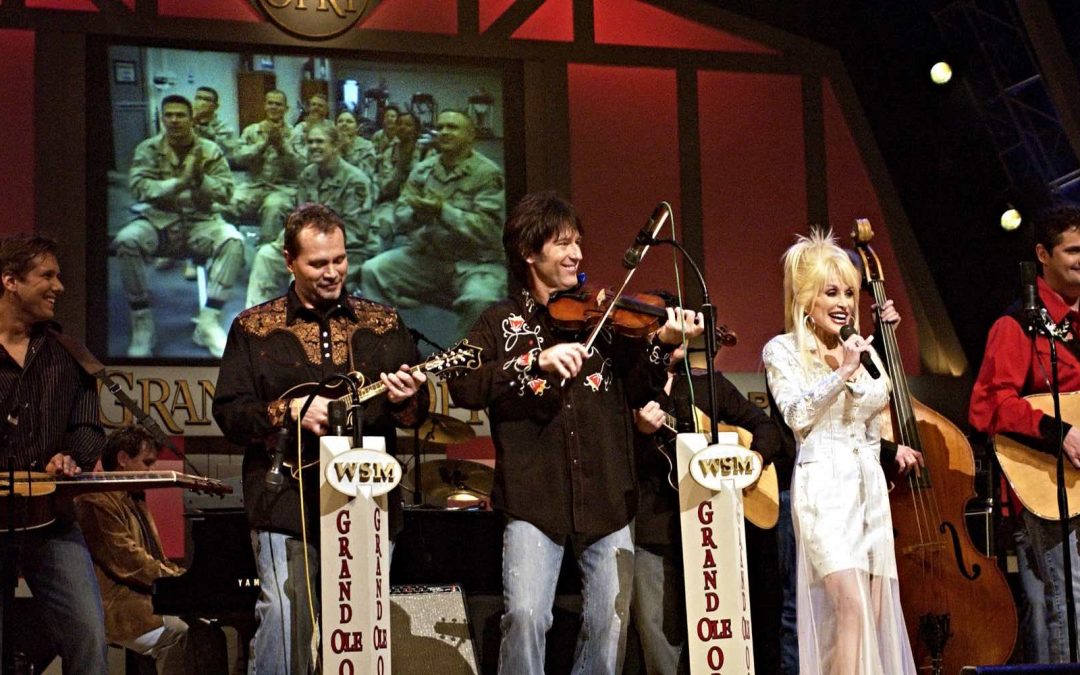 Dolly Parton performing at the Grand Old Opry