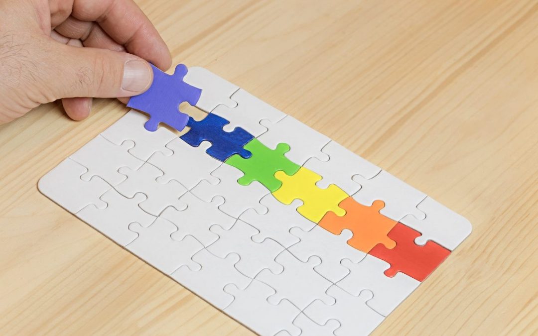 Jigsaw puzzle with a line of rainbow piece