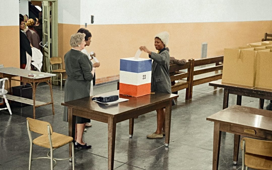 African American woman casting her ballot