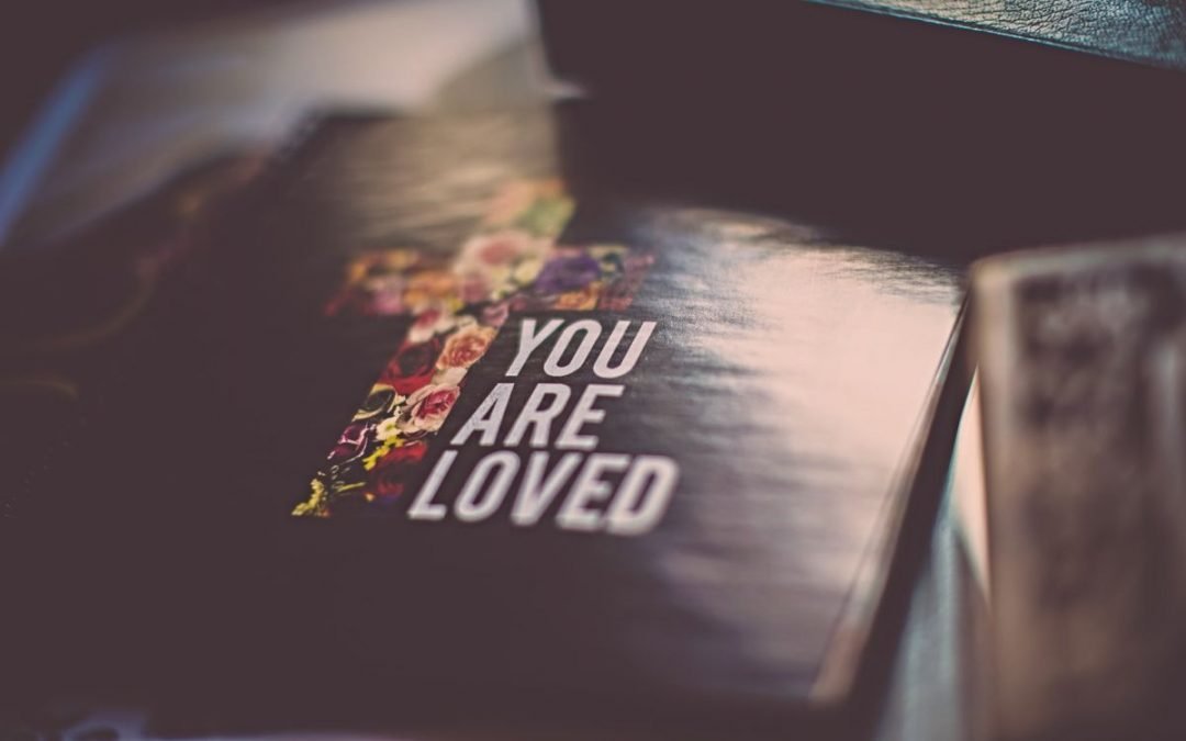 Bible with words You Are Loved on cover