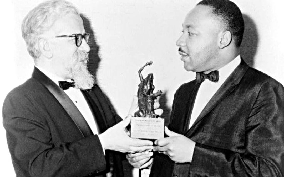 Rabbi Abraham Joshua Heschel left, and Martin Luther King Jr.