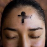 Sneaking Off to Mass and Returning with a Face Tattoo
