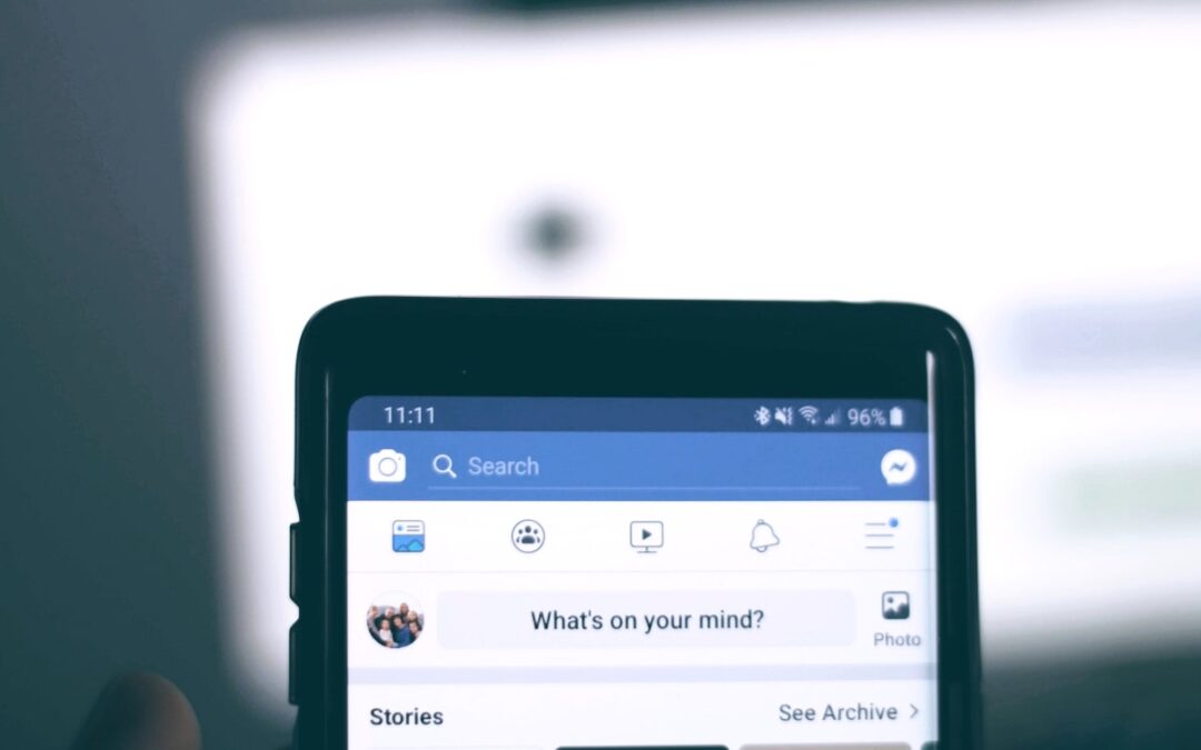 The top of a smartphone showing the “What’s on your mind?” question on the Facebook posting field.