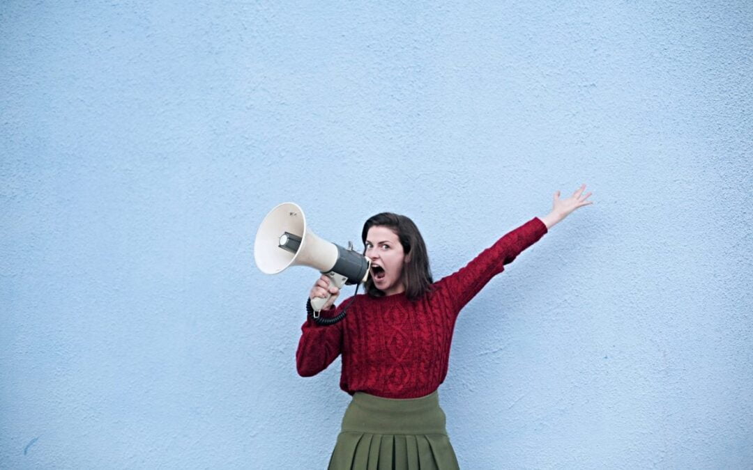 Woman yelling into megaphone
