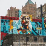 A mural on the side of a building with the words, “Voting Rights Are Human Rights” at the top.