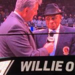 Willie O’Ree being interviewed during an NHL game in 2018.