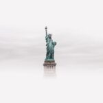 The Statue of Liberty surrounded by thick fog.