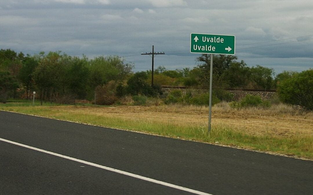 A road sign with an arrow pointing toward the town of Uvalde in southwest Texas.