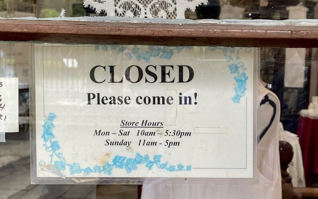 A sign on a local store in New Orleans that says, “CLOSED. Please come in!”