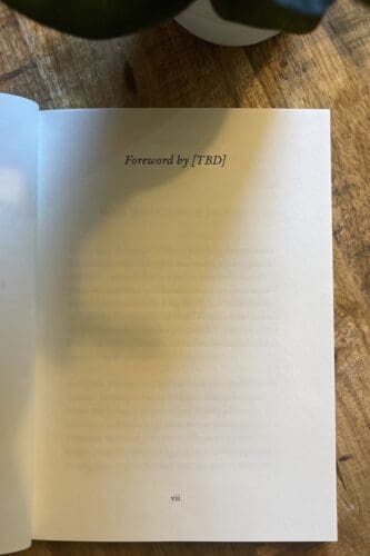A book open to the foreword page, which is still blank.