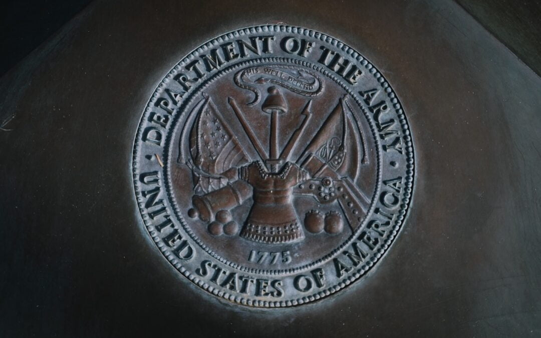 A metal seal of the U.S. Army.