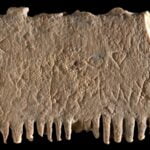 A 17th century BCE inscription in Porto-Canaanite script from Lachish, incised on an ivory lice comb.