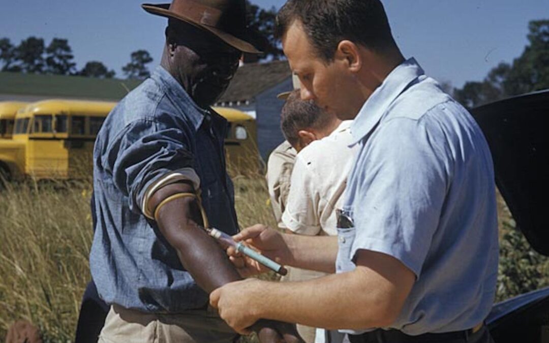An African American male is tested and treated during the Tuskegee Study.