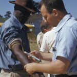 An African American male is tested and treated during the Tuskegee Study.