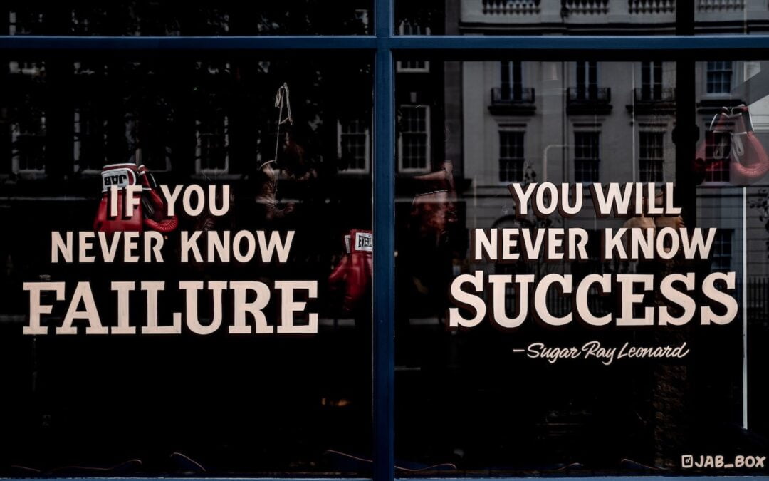 The exterior window of a gym that displays the saying, “If you never know failure, you will never know success.”