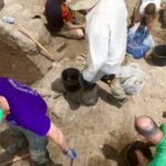 People seen from above in a pit during an archaeological dig in Jezreel.