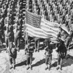 Black soldiers standing at attention who were part of the 41st Engineers regiment in North Carolina during World War 2.