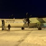 Passengers board a flight from Tromsø to Bergen, Norway.