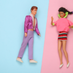 Barbie and Ken dolls placed on pink and blue backgrounds.