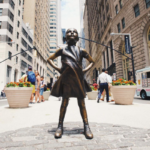 Fearless Girl, a bronze sculpture by Kristen Visbal across from the New York Stock Exchange Building in Manhattan, New York.
