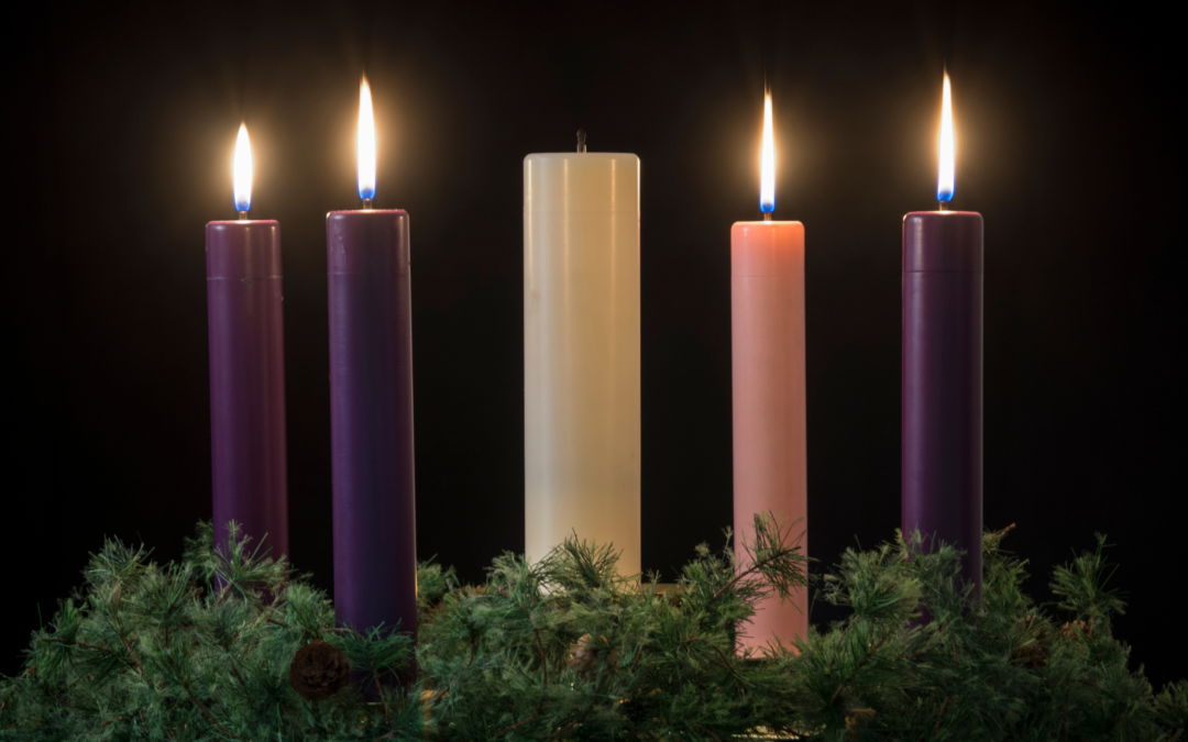 Four lit Advent candles with Jesus candle unlit.