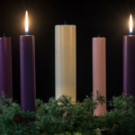 Two lit advent candles.