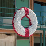 A photo of a wreath hanging outside the Lorraine Motel balcony.