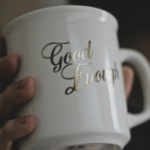 A coffee mug with the words “Good Enough.”