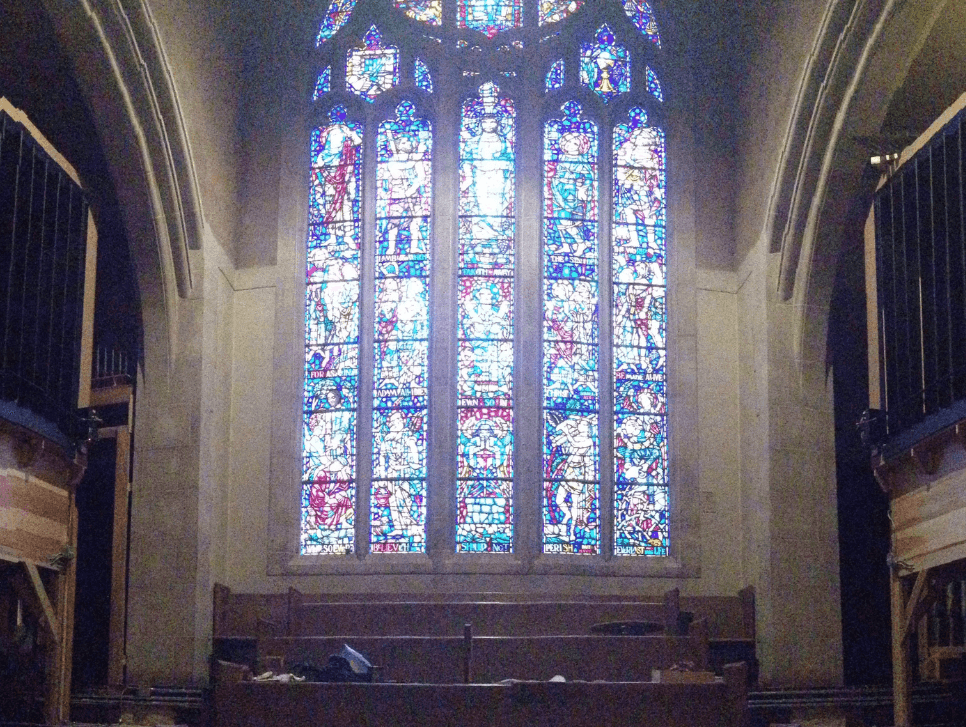 A photo of the stained-glass window and organ at the First Baptist Church of the City of Washington, D.C.