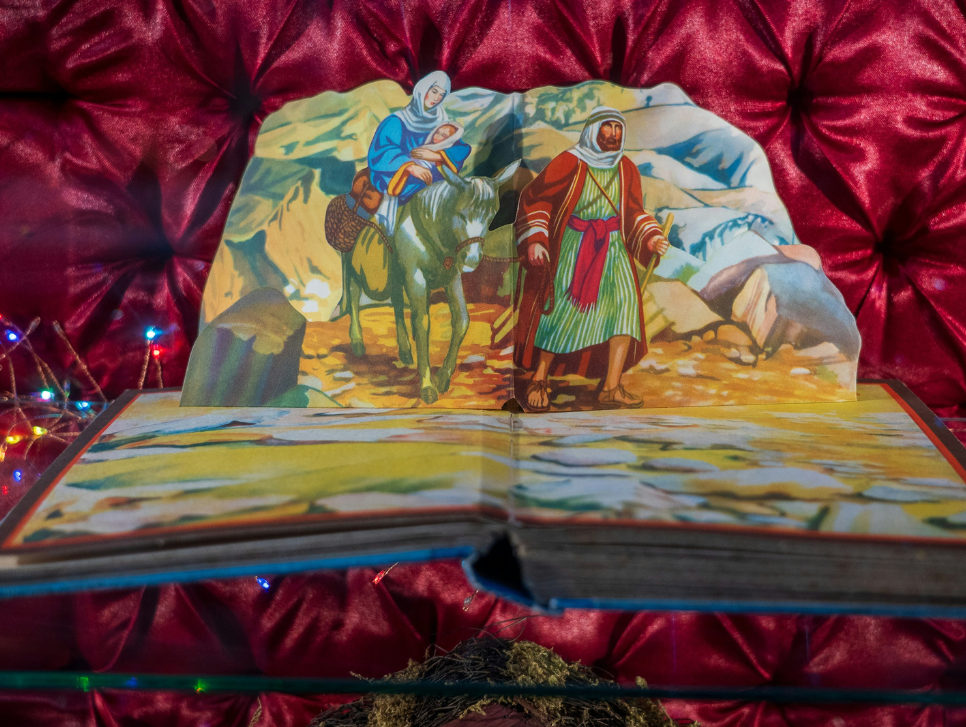 A popup book opened to a nativity scene.