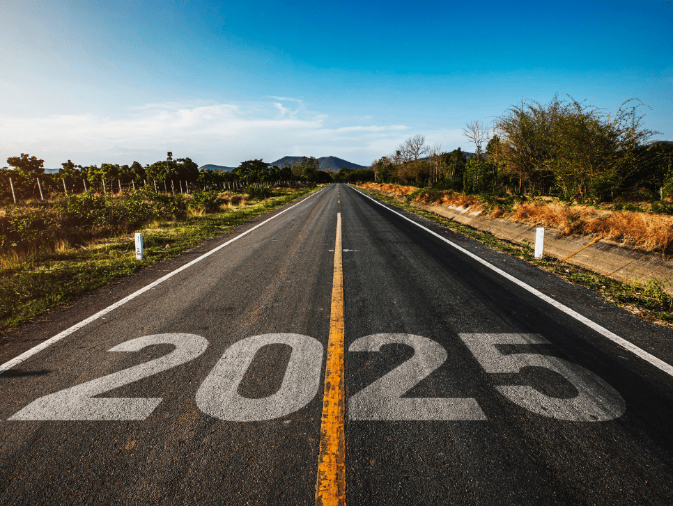 “2025” written on an asphalt road