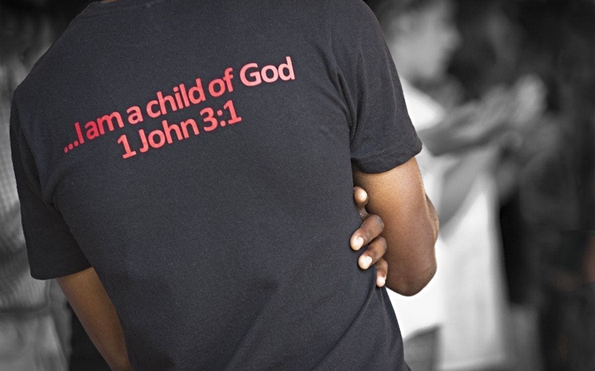 Young African American man with T-shirt with 1 John 3:1