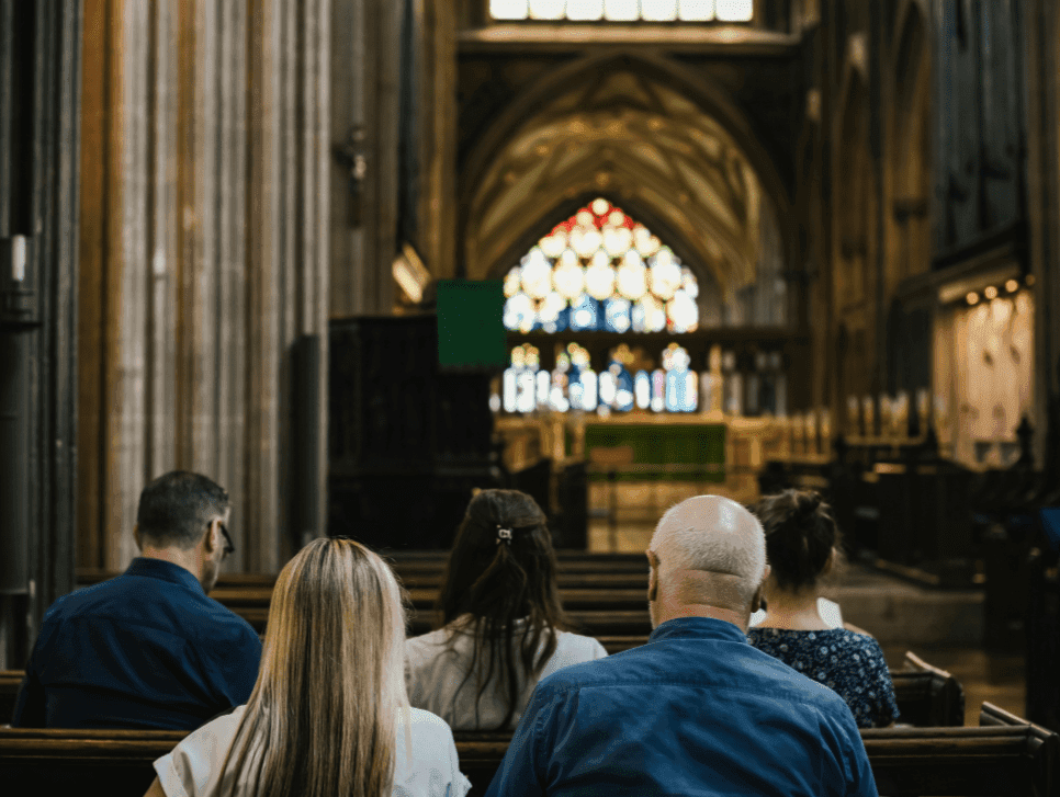 A photo of worshippers in an Anglican Church