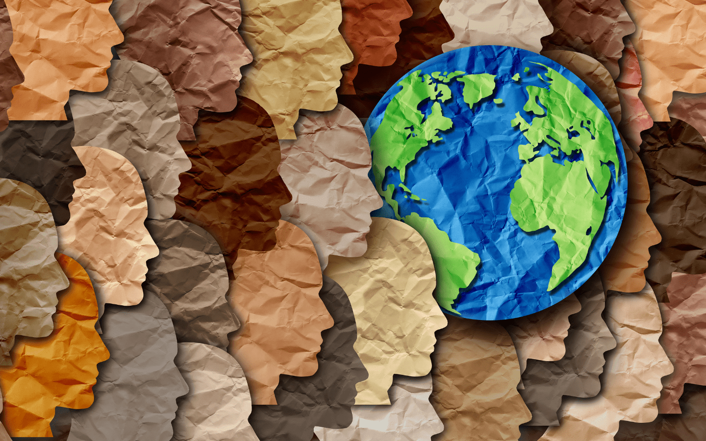 An artistic rendering of many faces with different skin colors.