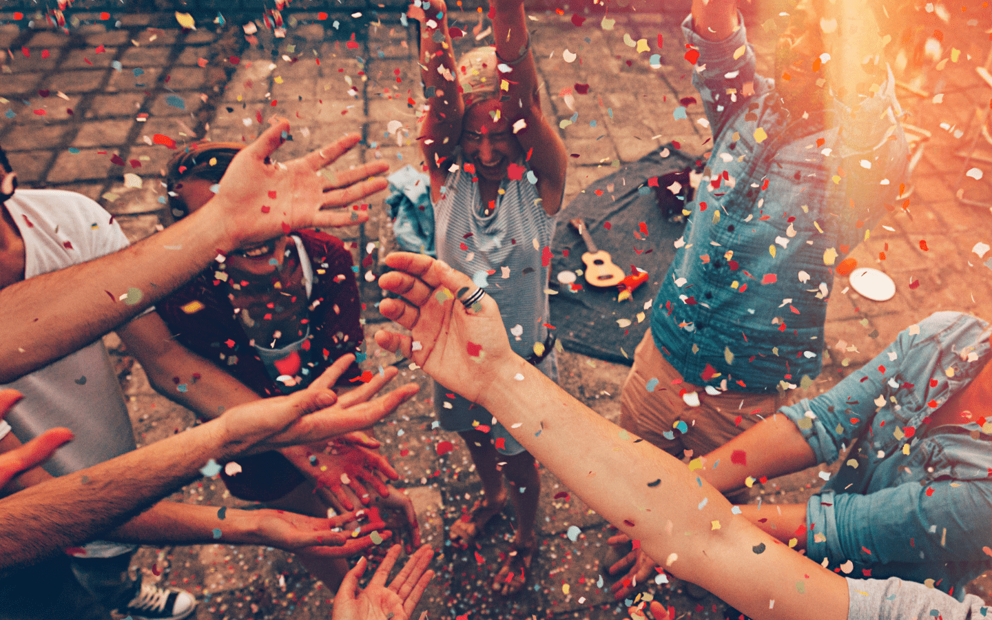 A photo of people celebrating with confetti.