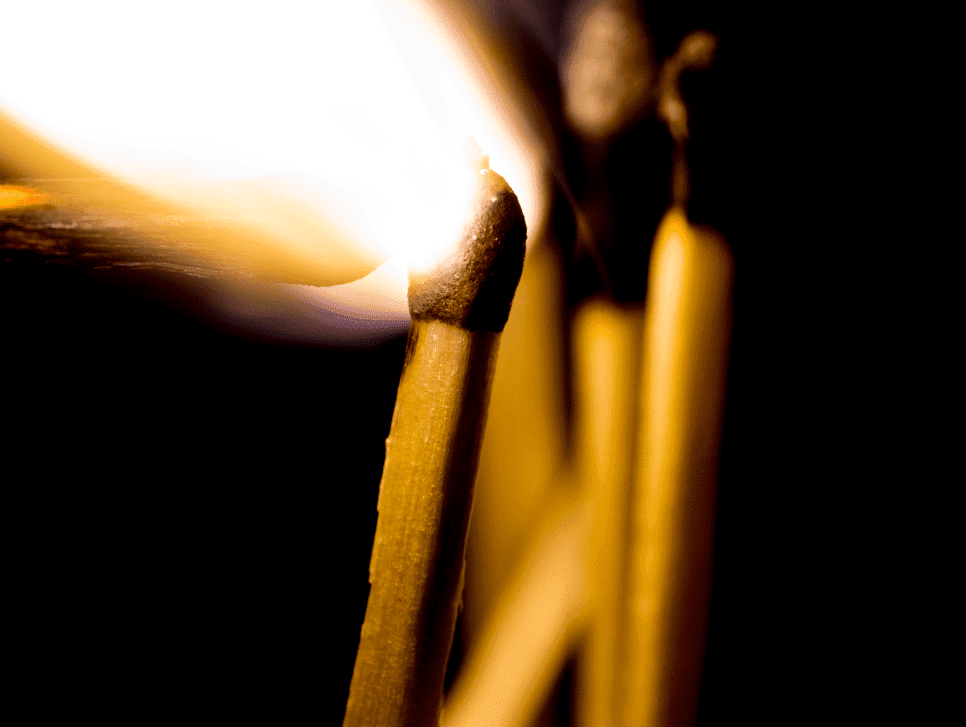 A matchstick lit before lighting others
