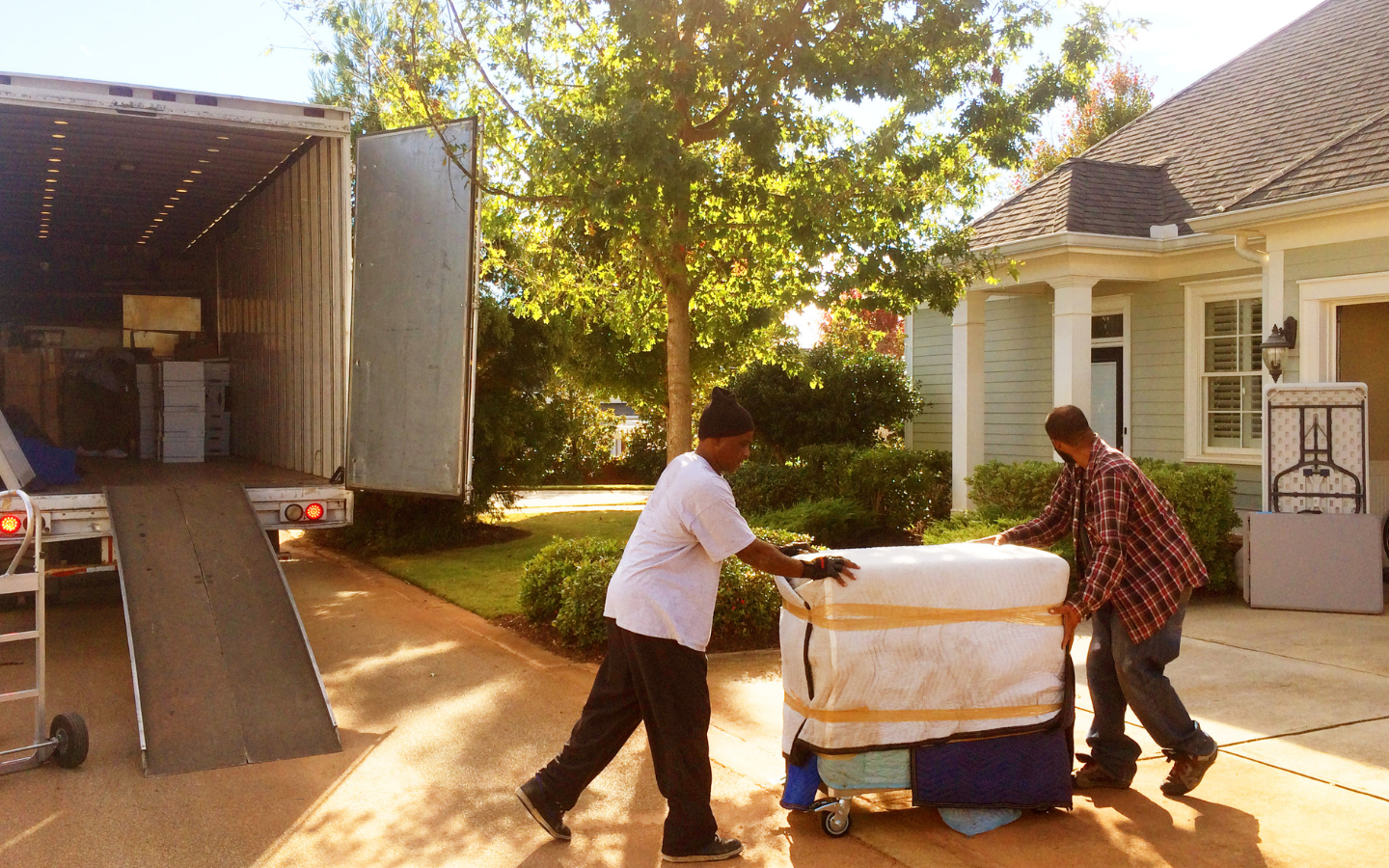 A photo of people moving into a new house.
