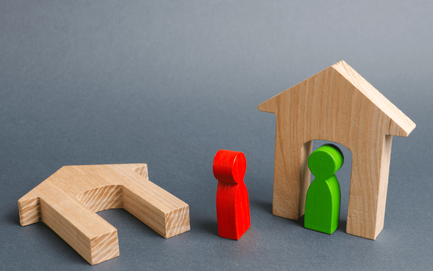 Wooden toy depiction of two neighbors
