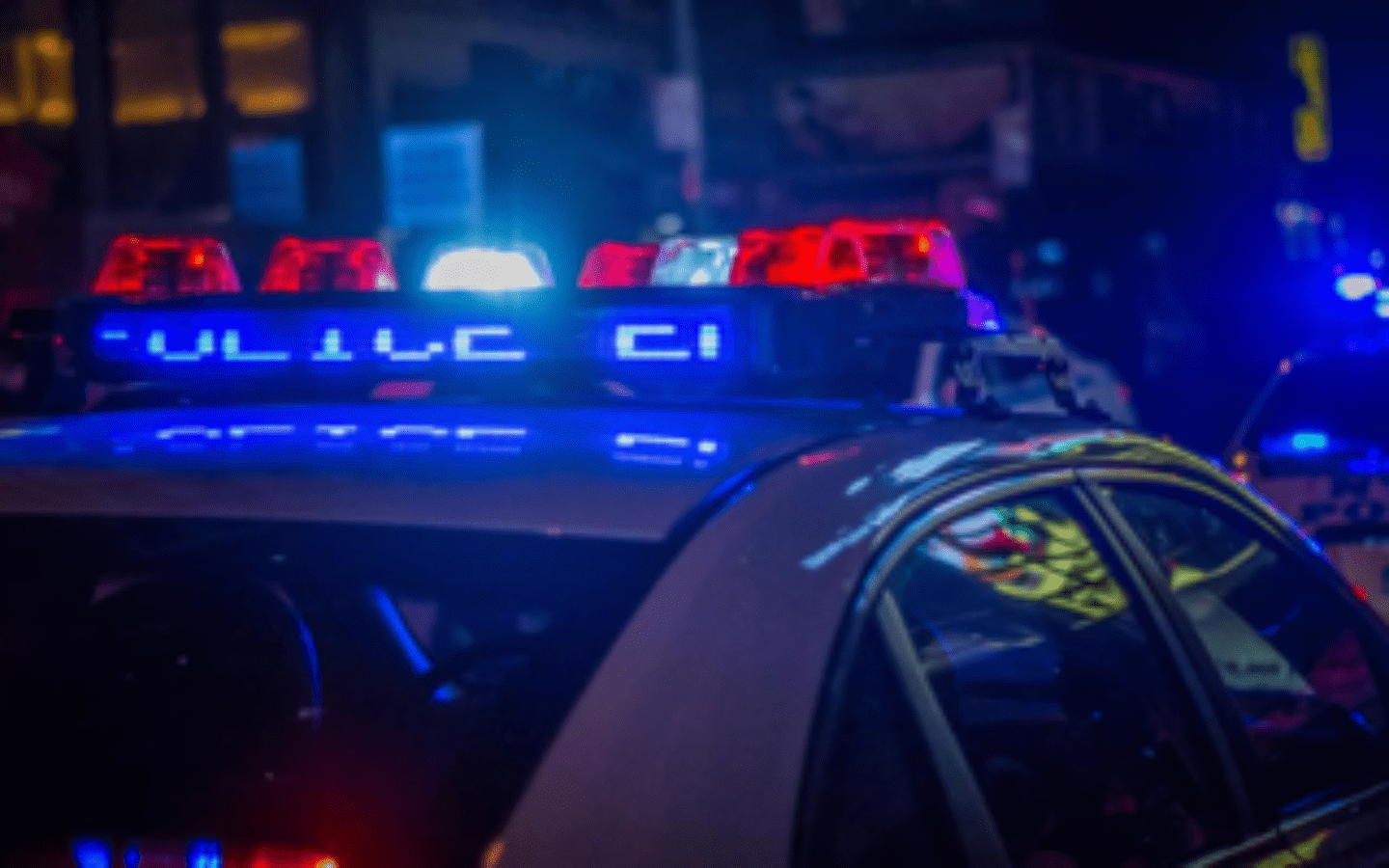 Multiple police cars with flashing lights.