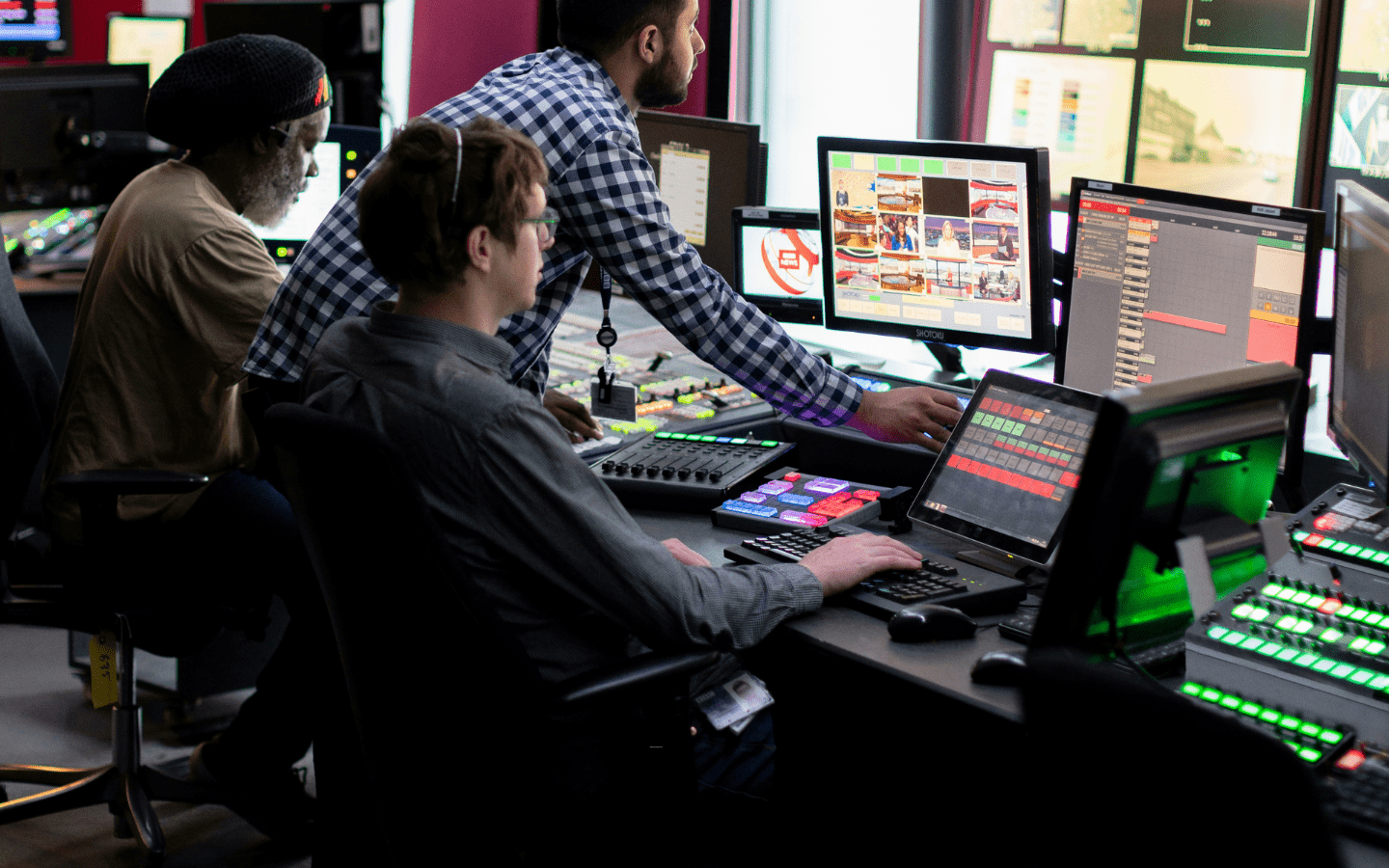 A photo of behind-the-scenes engineers recording a television show.